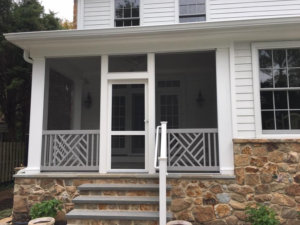 A house is being built with scaffolding and a roof.