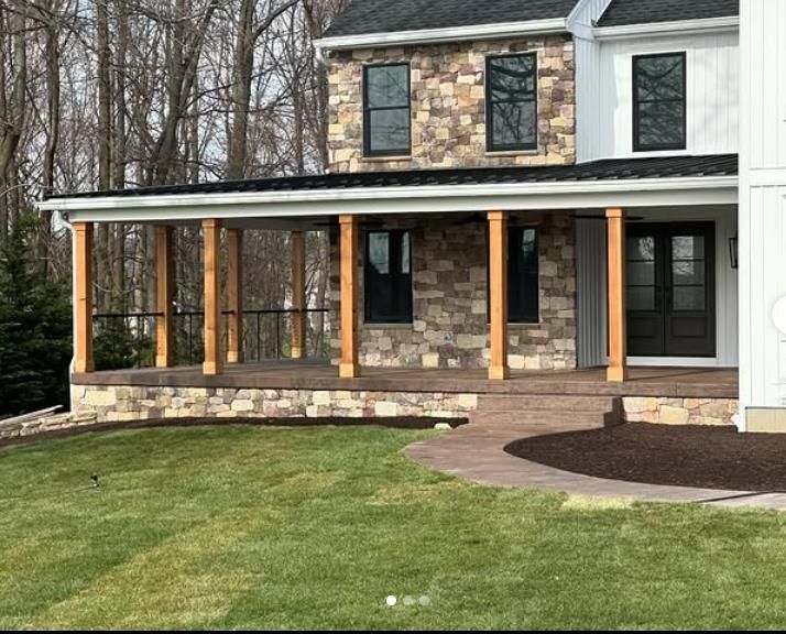 A wooden deck is being built next to a pool.