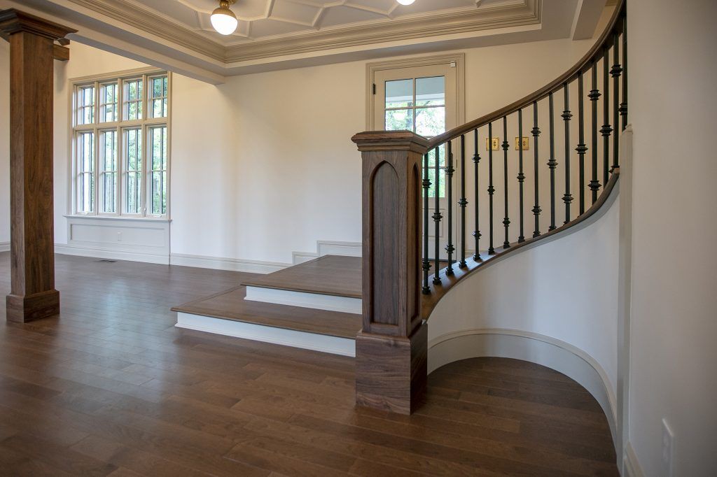 At New Beginnings Construction, we will remodel your living room and staircase.
