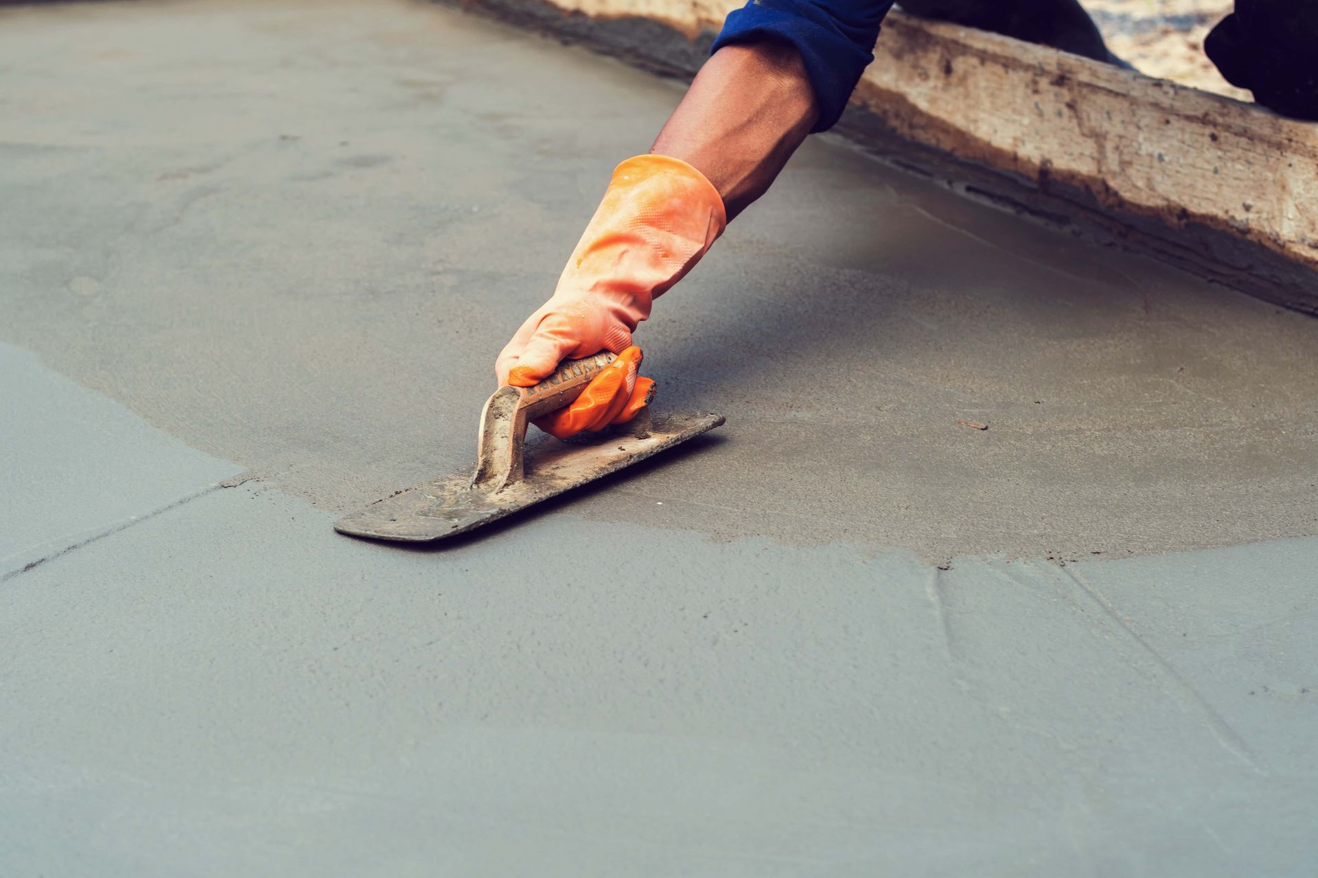 A man smoothing out concrete