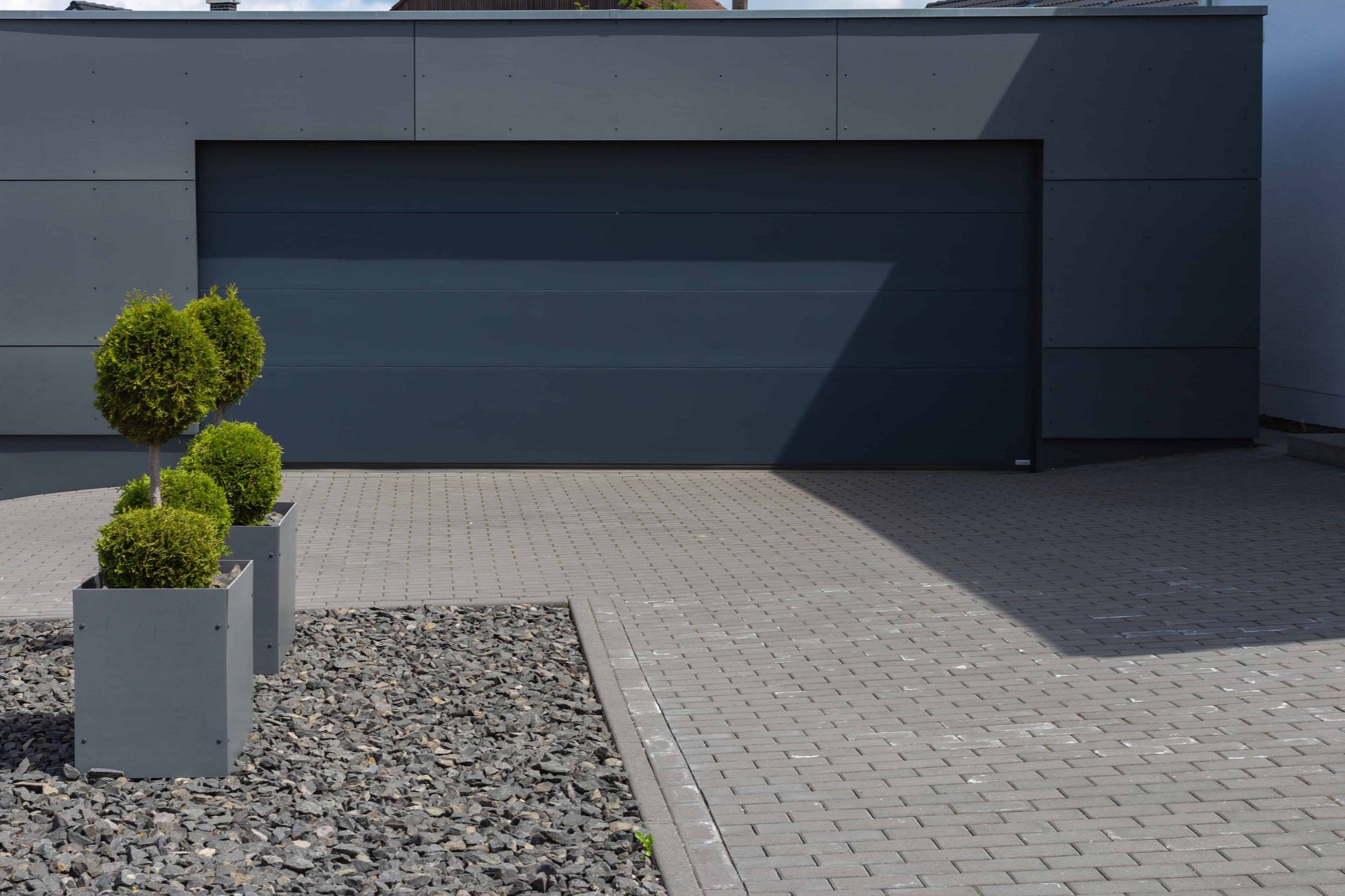 a brick concrete driveway