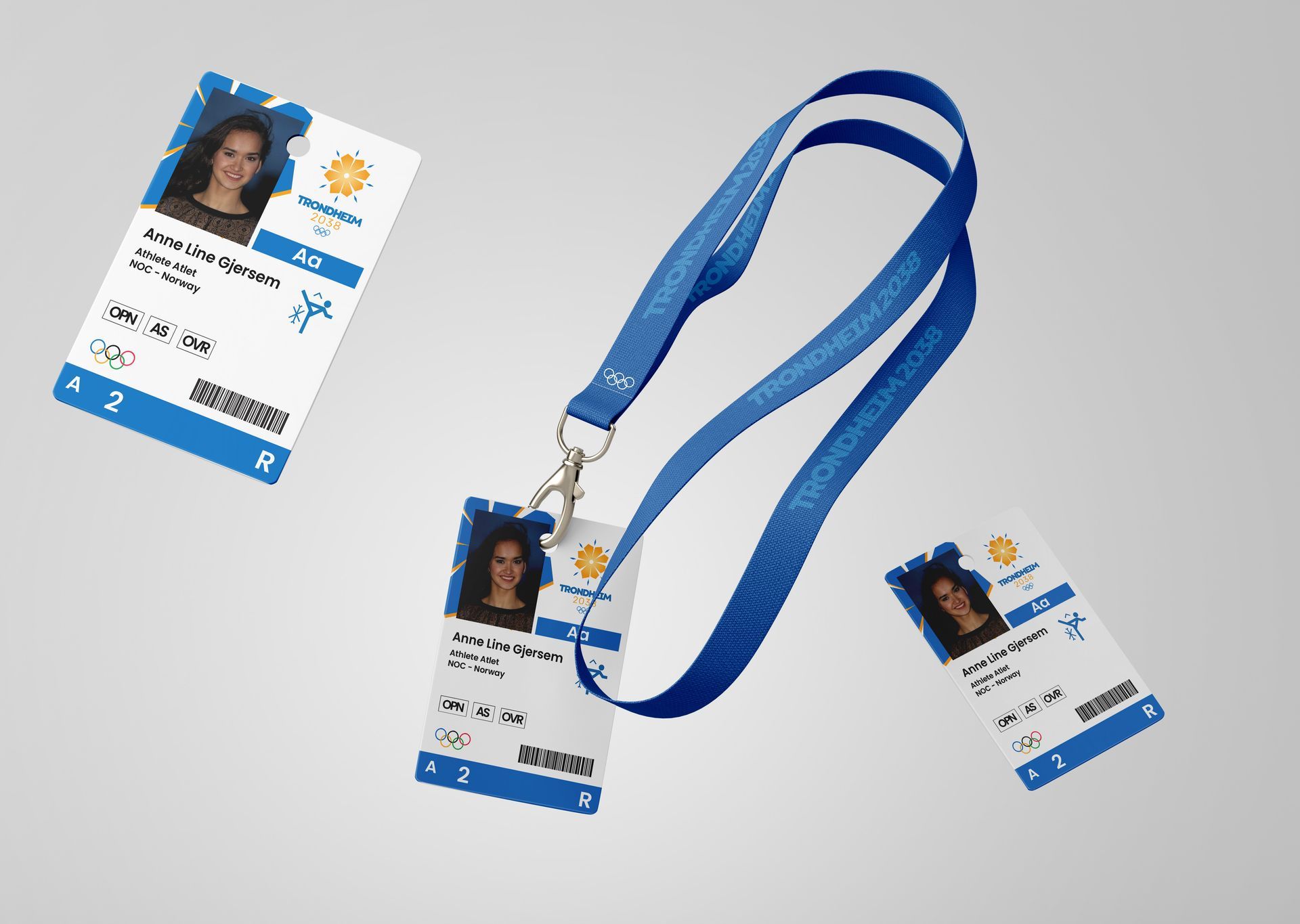 Blue lanyard with two ID badges, one attached and two shown separately on a light gray background
