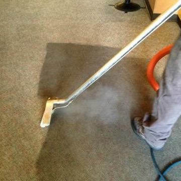 Carpet cleaning - Cleaning carpet with vacuum cleaner in Milwaukee, WI