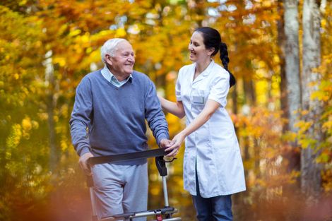 Nurse Assisting Old Man To Walk — Tucumcari, NM — Helping Hands Hospice