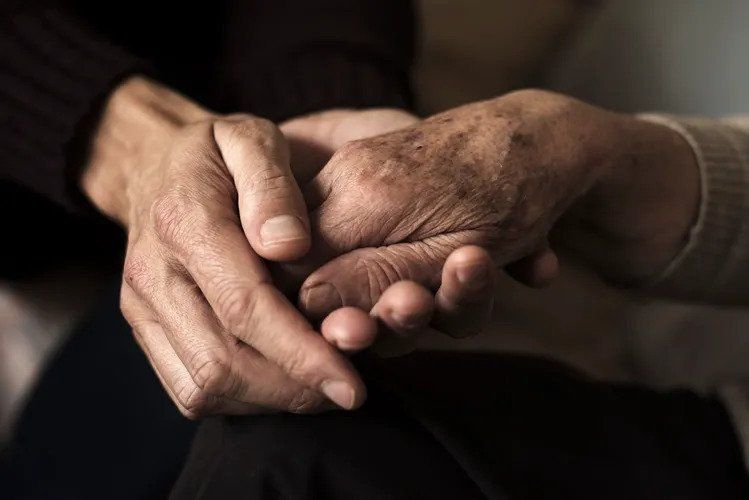 Two Hands Holding Each Other — Tucumcari, NM — Helping Hands Hospice