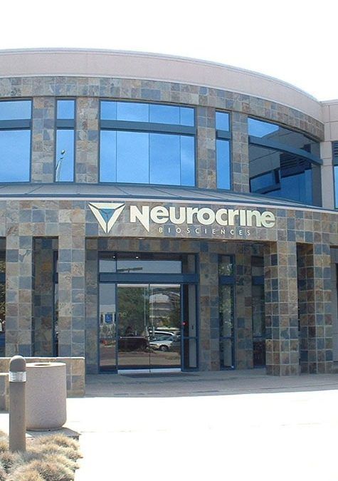 A large building with a sign that says neurocrine on it
