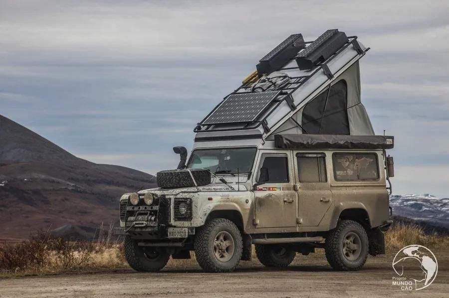 A Jeep With a Tent on Top of It is Parked on a Dirt Road — Whitsunday 4x4 & Automotive In Cannonvale, QLD