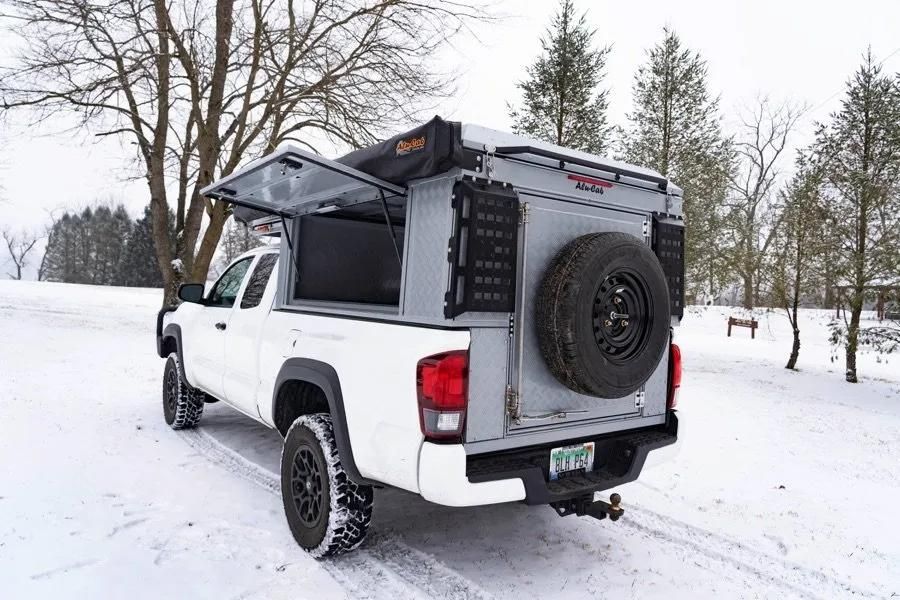 A White Truck With a Canopy on Top of It is Parked in the Snow — Whitsunday 4x4 & Automotive In Cannonvale, QLD