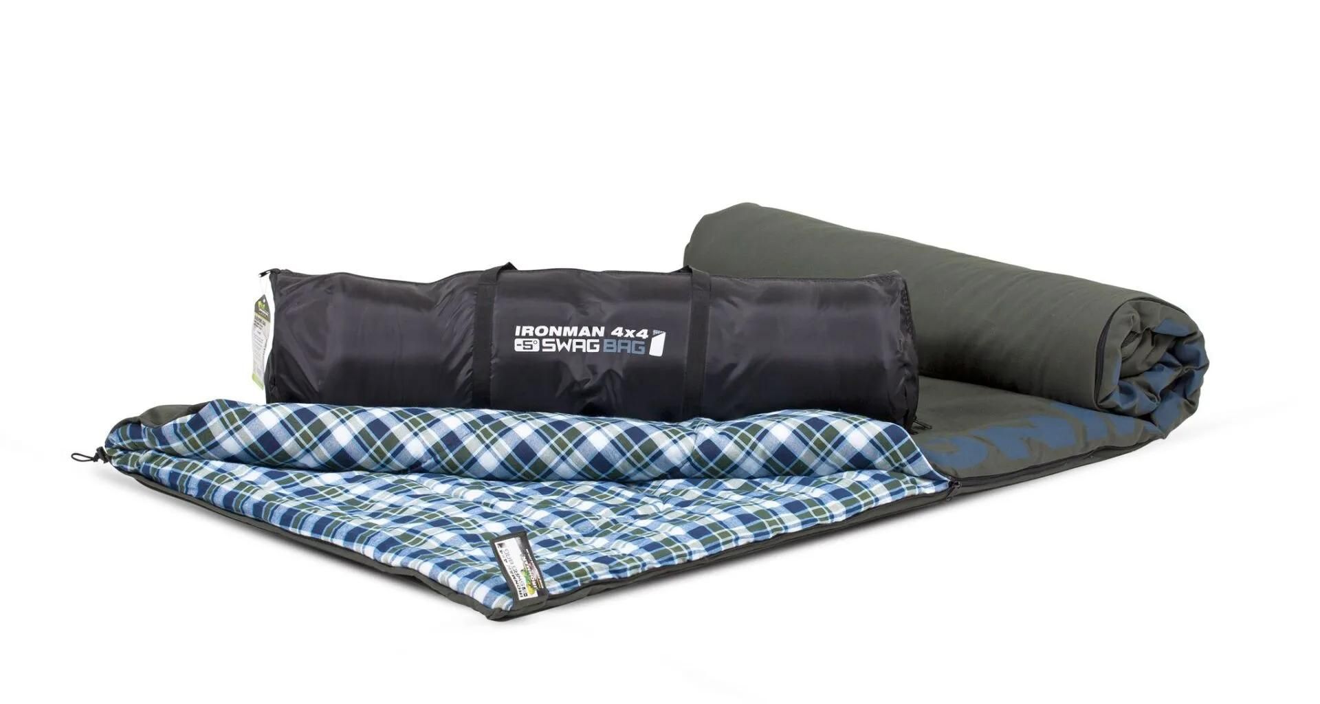 A Sleeping Bag and a Blanket Are Rolled Up on a White Surface — Whitsunday 4x4 & Automotive In Cannonvale, QLD