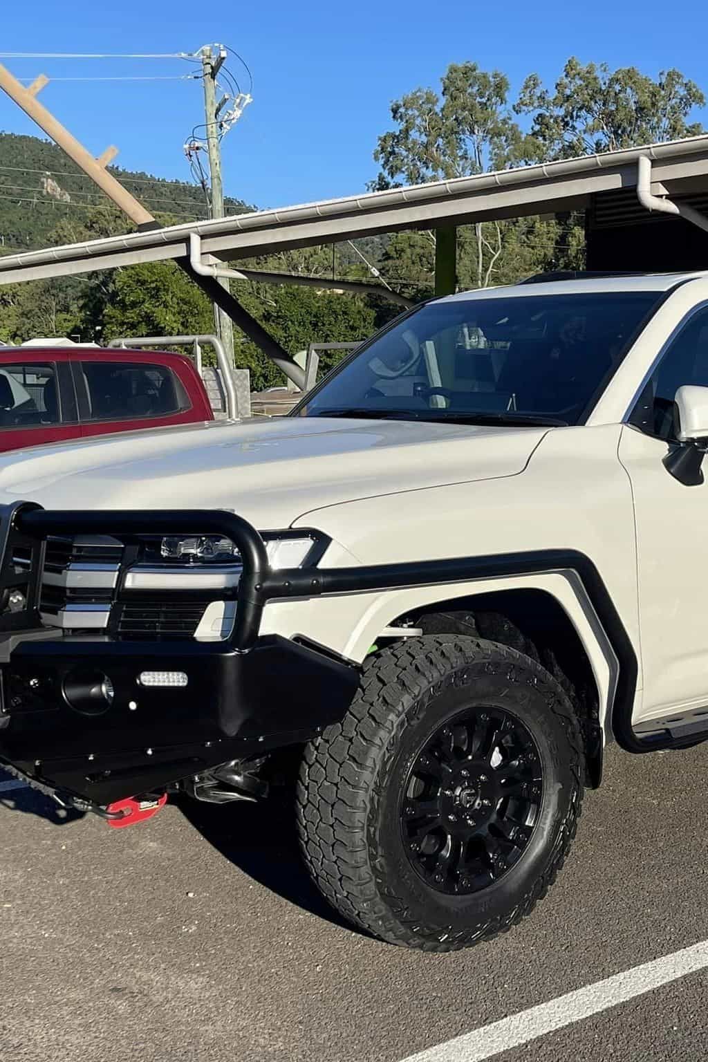 A White Truck With a Black Bumper is Parked in a Parking Lot — Whitsunday 4x4 & Automotive In Cannonvale, QLD