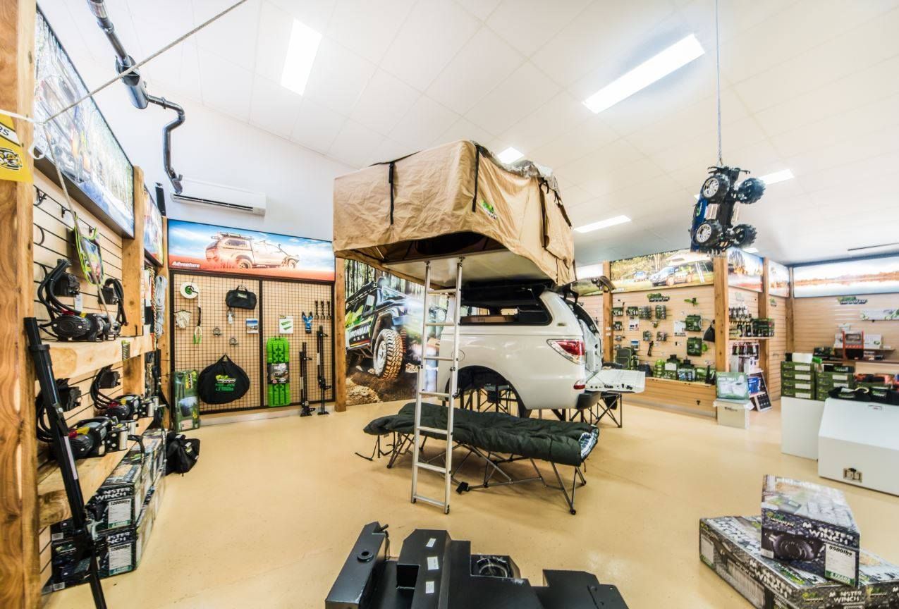 A Car With a Tent on Top of It in a Store — Whitsunday 4x4 & Automotive In Airlie Beach, QLD