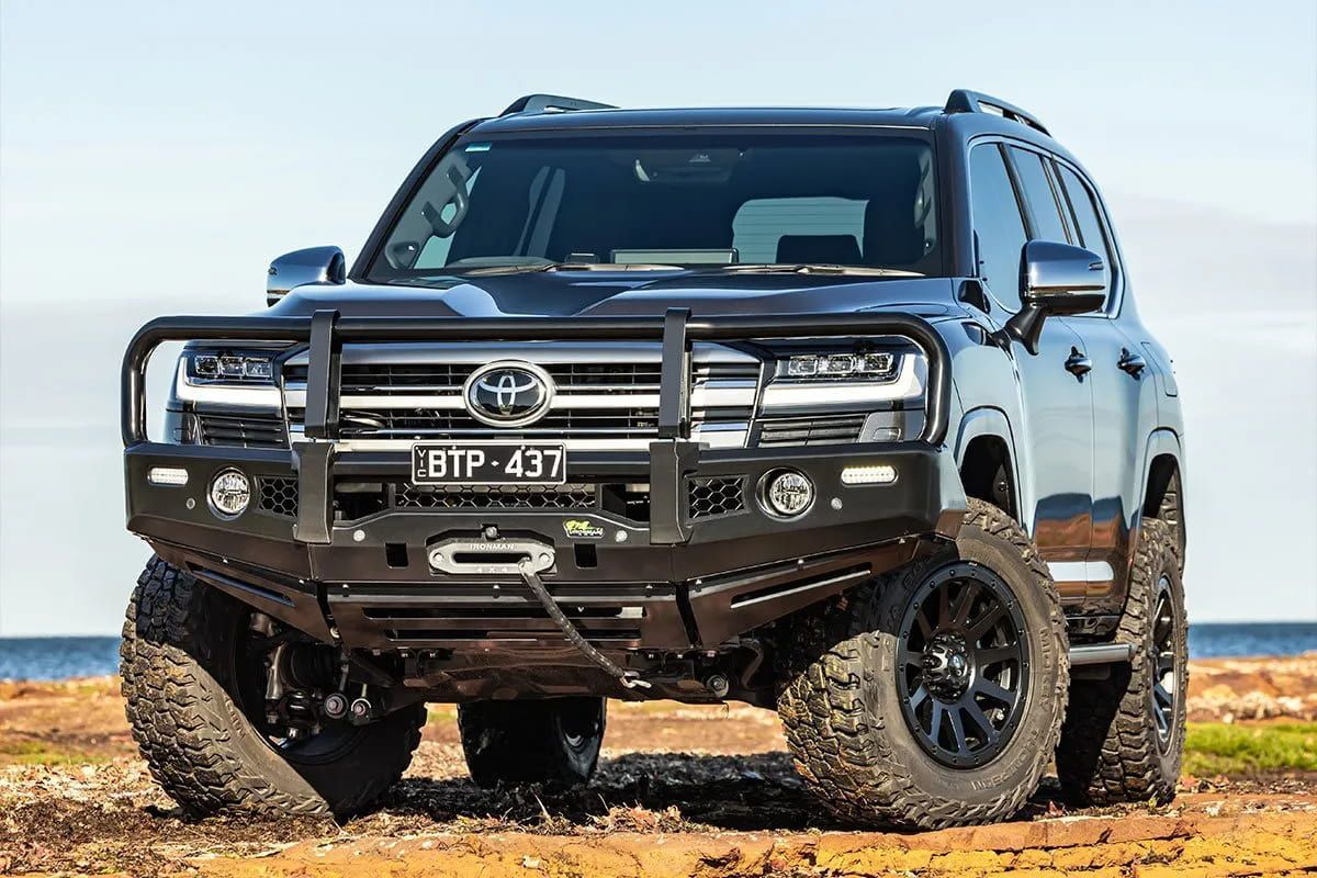 A Black Toyota Land Cruiser is Parked on a Dirt Road — Whitsunday 4x4 & Automotive In Cannonvale, QLD