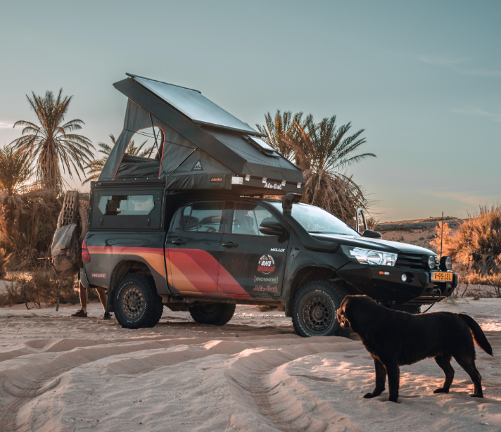 A Truck with a Tent on Top of it - Whitsunday 4x4 & Automotive In Cannonvale, QLD