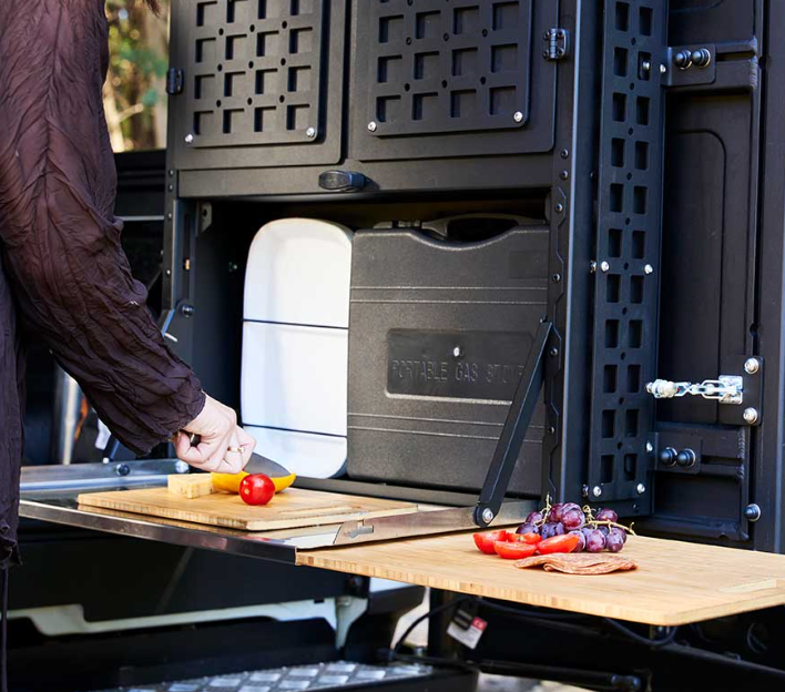 A Person is Cutting Vegetables on a Wooden Cutting Board -  Whitsunday 4x4 & Automotive In Cannonvale, QLD