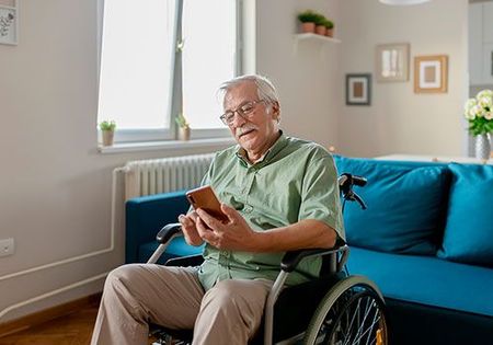 Senior Man Using Smartphone — Austin, TX — Lakeway Mobility