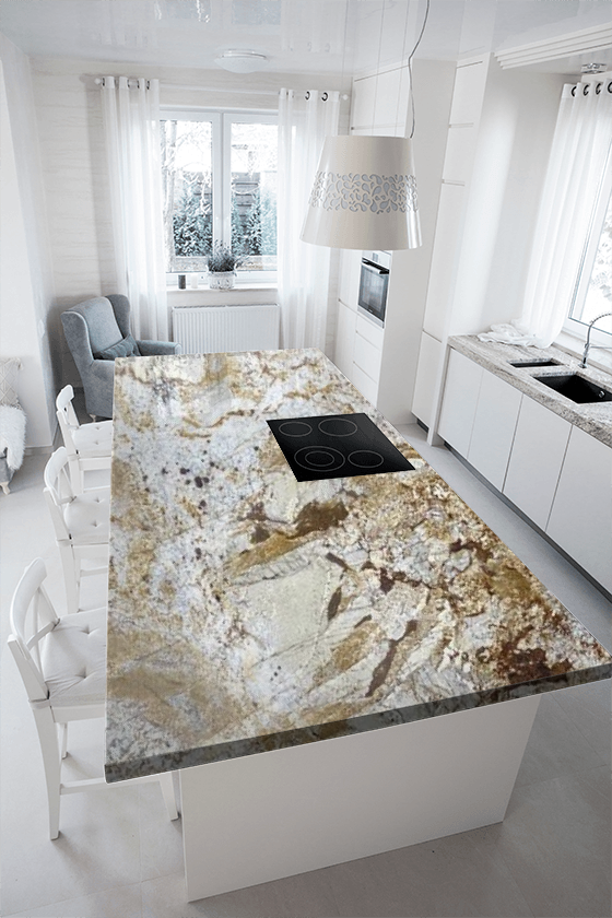 A kitchen with a large granite counter top and white cabinets.