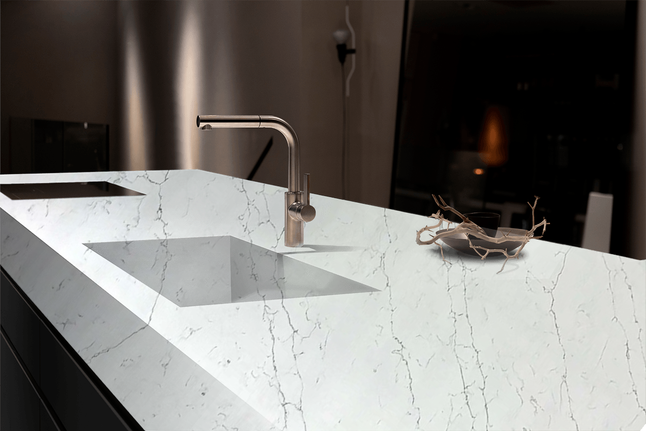 A kitchen counter with a sink and a faucet on it.
