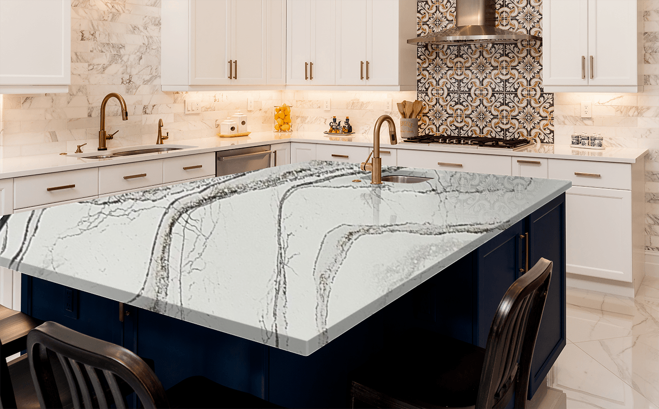 A kitchen with a large island and a marble counter top.