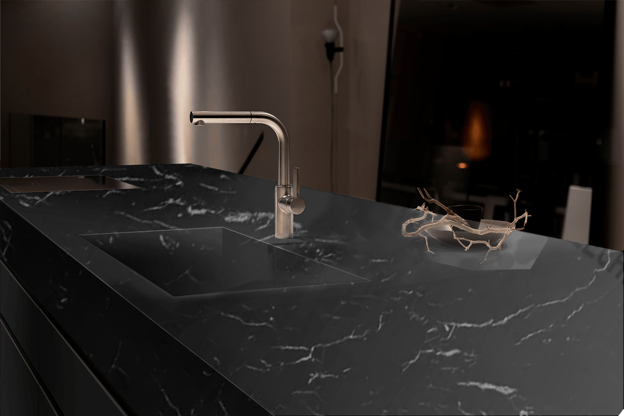 A kitchen counter with a sink and a faucet on it.