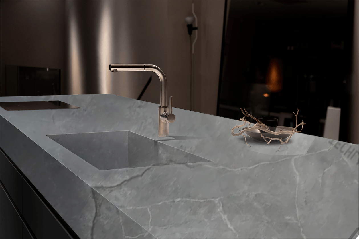 A kitchen counter with a sink and a faucet