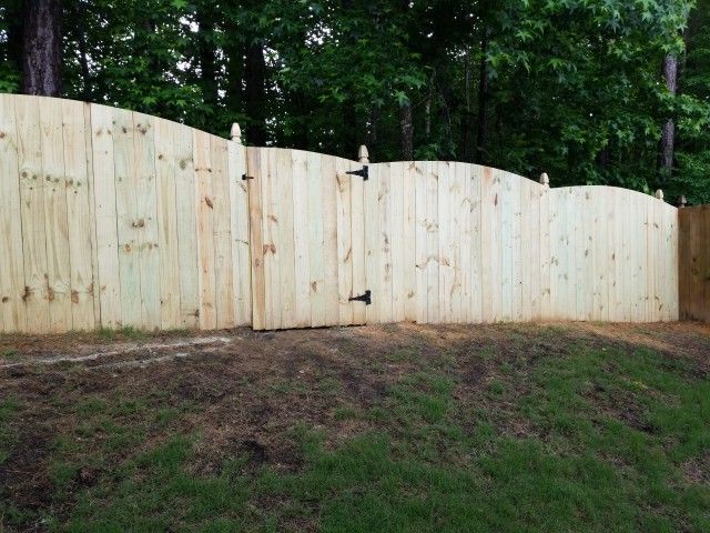 Worker after fence installation