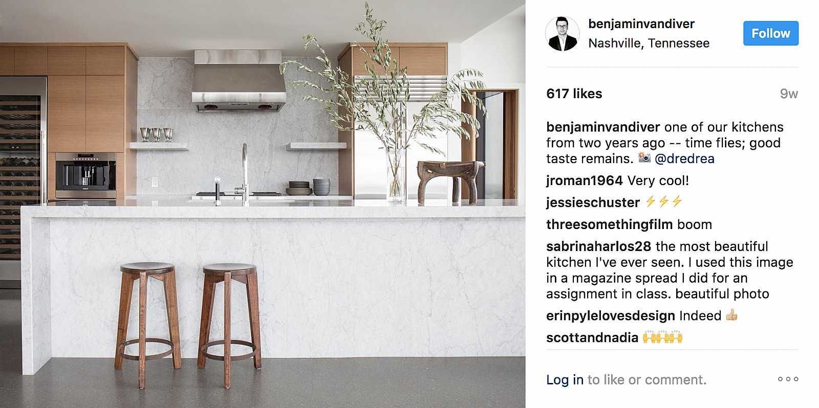 A picture of a kitchen with two stools next to it