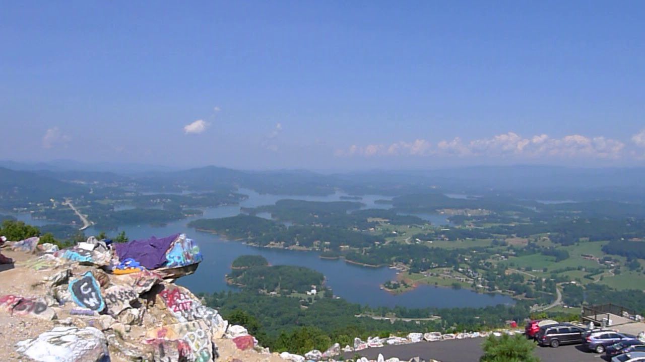 A view of a lake from the top of a mountain
