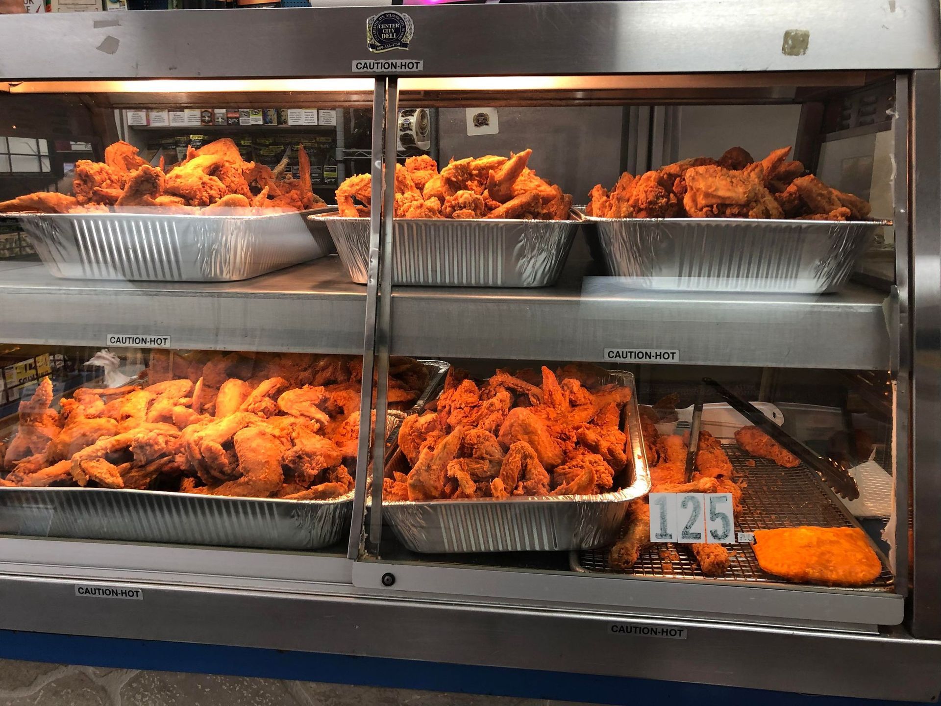 fried chicken inside hot display case