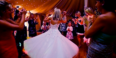 bride dancing surounded by people