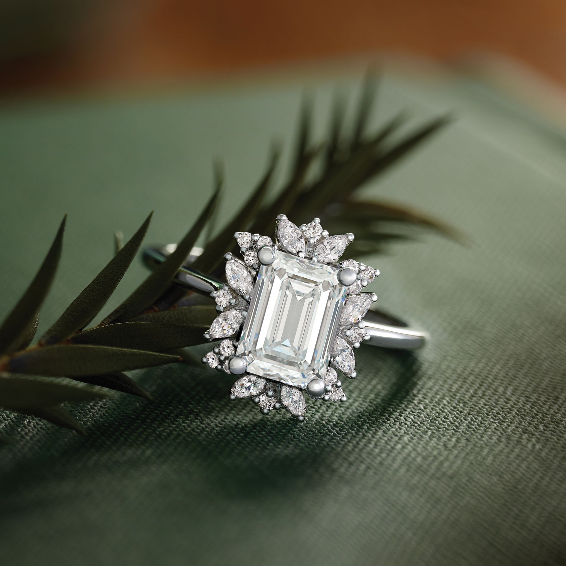 A ring with an emerald cut diamond in the center