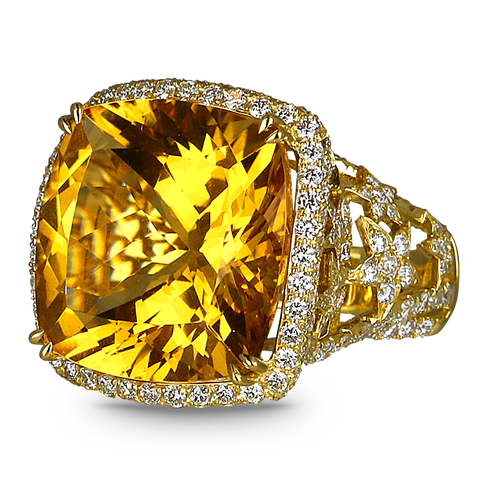 A gold ring with a yellow stone and diamonds