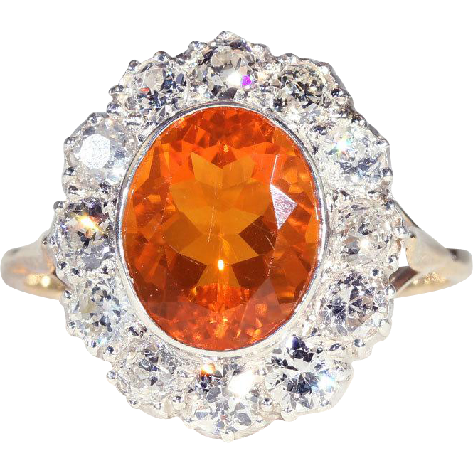 A ring with a large orange stone in the center