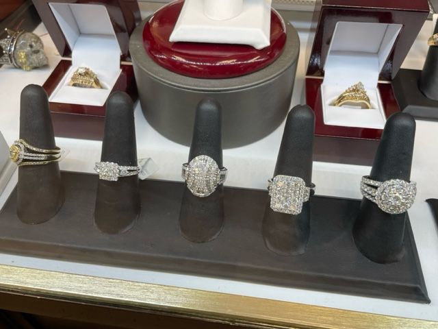 A variety of rings are displayed on a table