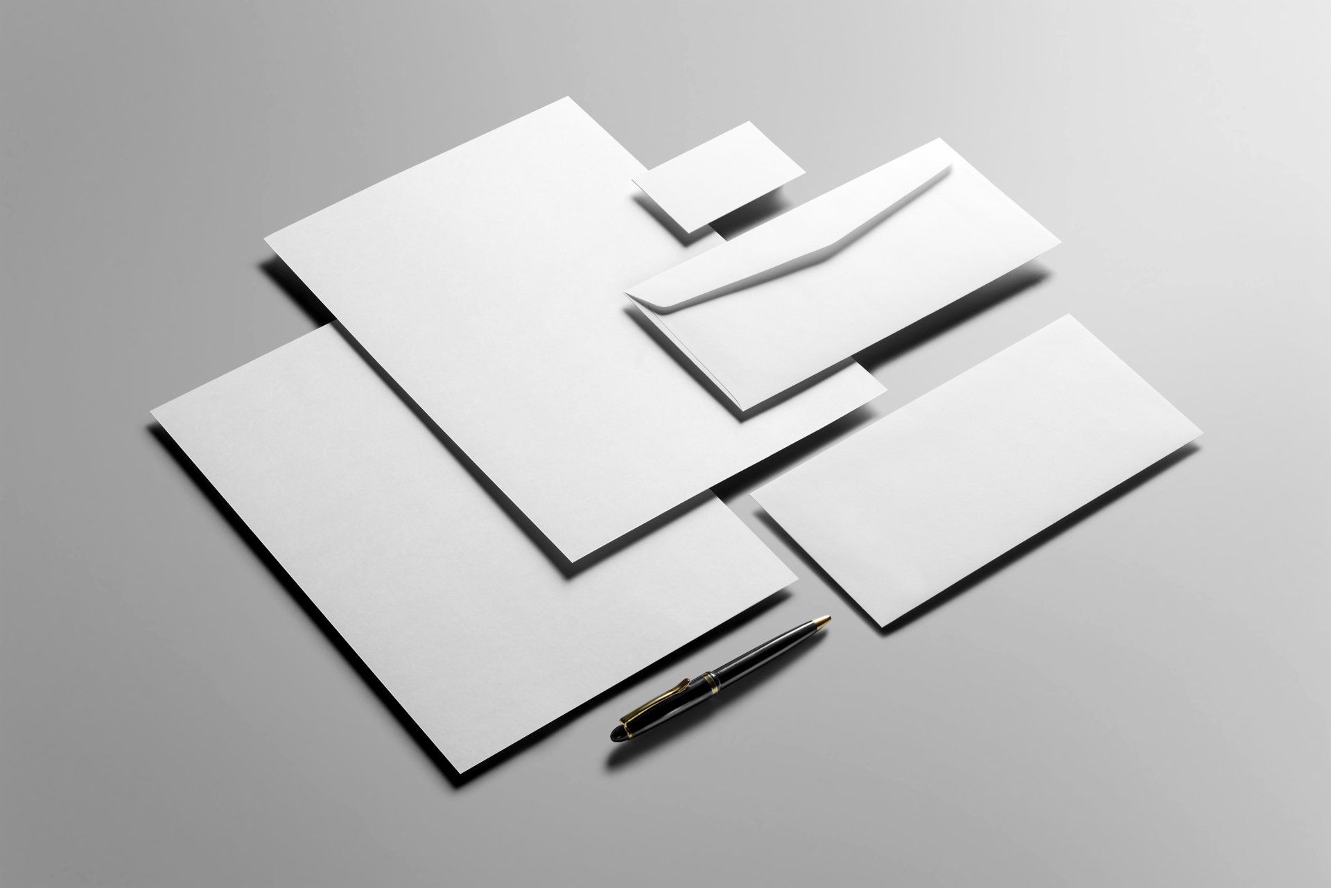 White nvelopes and a black pen