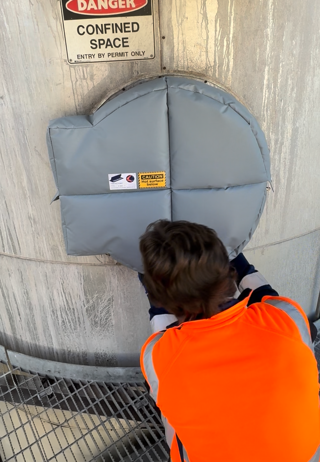 Insulock employee installing Thermocovers, Insulation Blankets, Insulation Jacketing over man-way