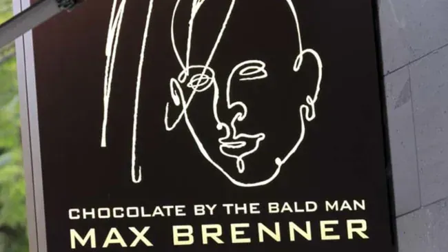 A Sign For Chocolate By The Bald Man Max Brenner — The Garis Group  In Hamilton, NSW 