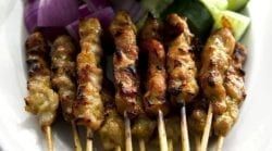 A White Plate Topped With Skewers Of Meat And Vegetables — The Garis Group  In Hamilton, NSW
