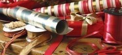 There Are Many Different Types Of Ribbons And Wrapping Paper On The Table — The Garis Group  In Hamilton, NSW