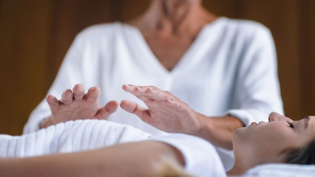 Reiki Healing session with woman at spa
