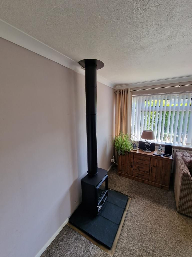 FDC 5 Wide, 5 kw multi fuel stove with tiled slabbed hearth and twin flue system supplied and installed by the Fireplace Isle of Wight 