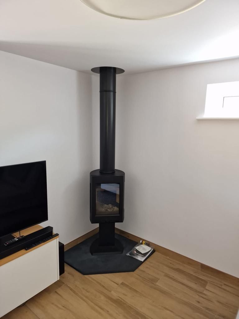 Jotul F305 7kw multi fuel stove and oak fascia supplied and installed by The Fireplace Isle of Wight 