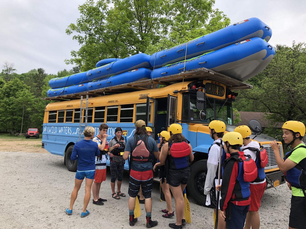 Bus carrying rafting boat