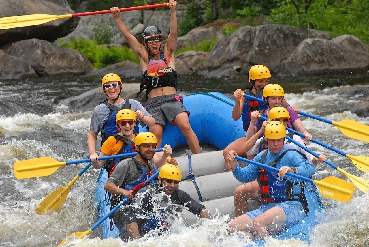 Group of people rafting in a river
