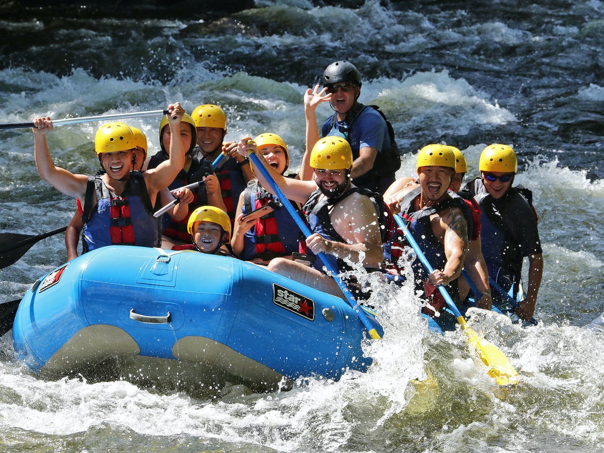 Group of people all in one rafting boat