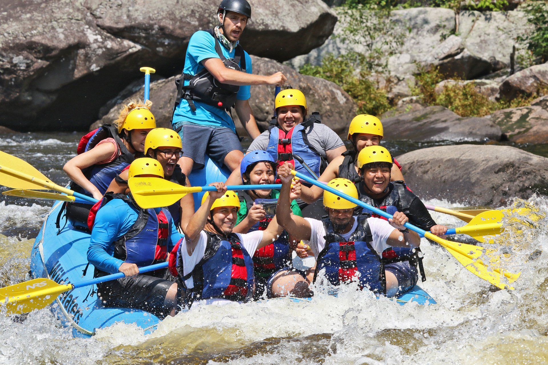 Many people on one rafting boat