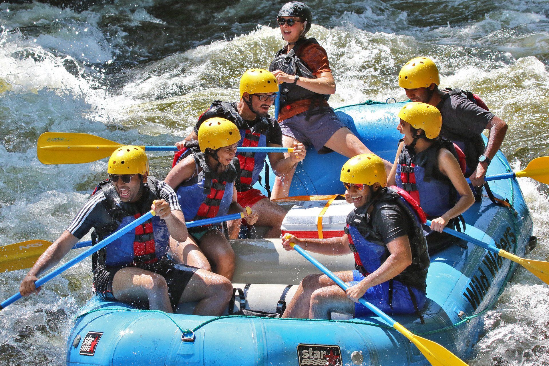 Group of happy people while rafting