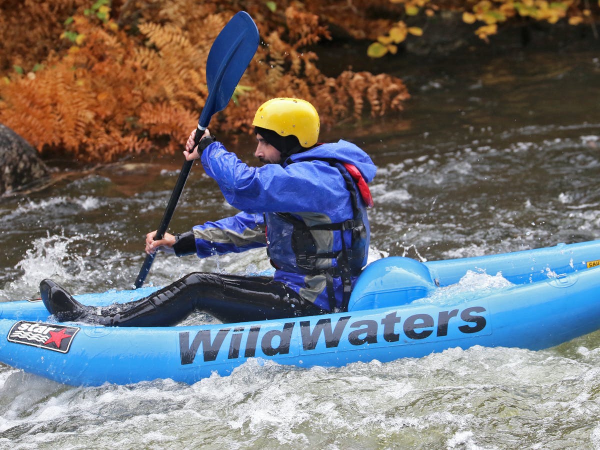 One man on kayak and paddling