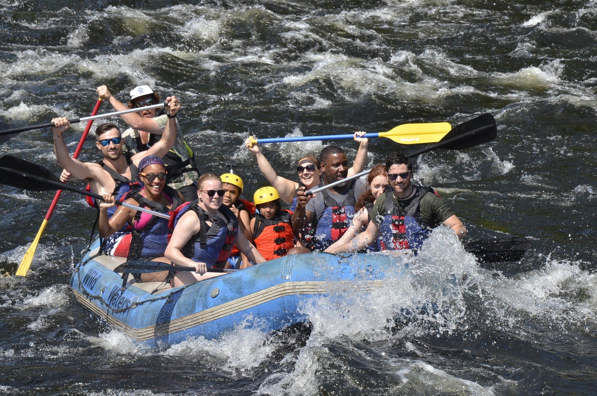 Group of people rafting in whitewater