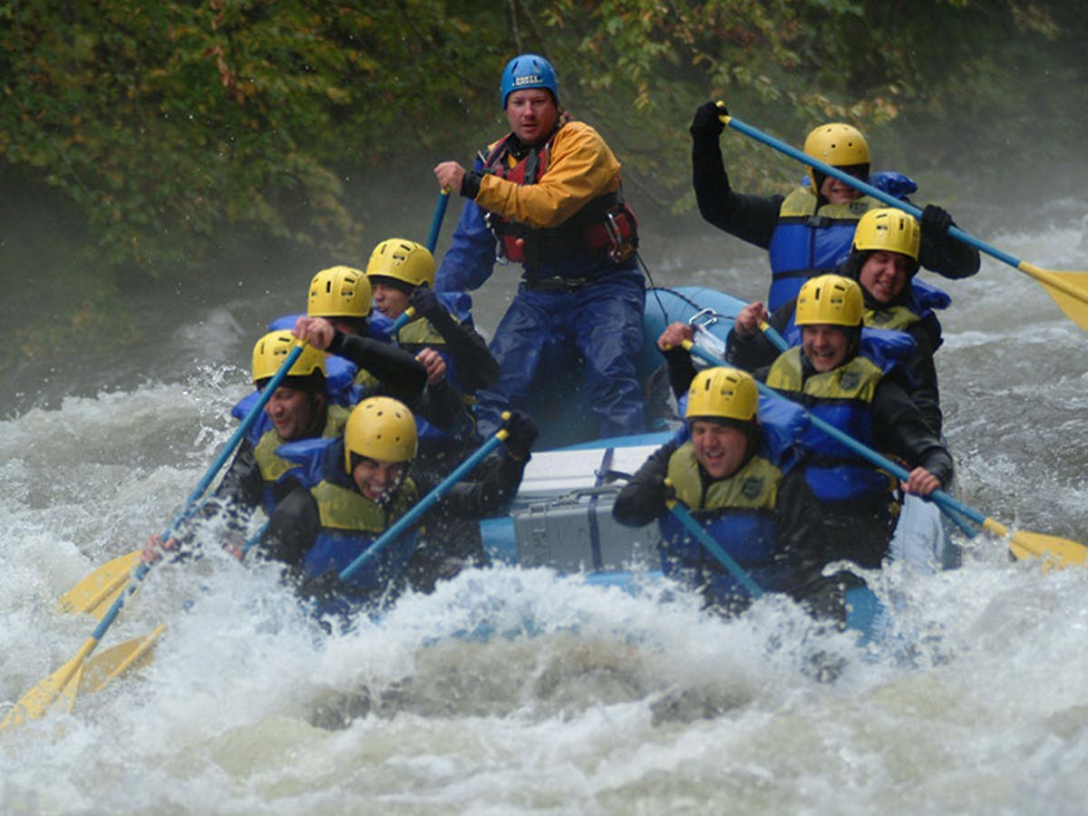 Group of people with yellow and blue life vest