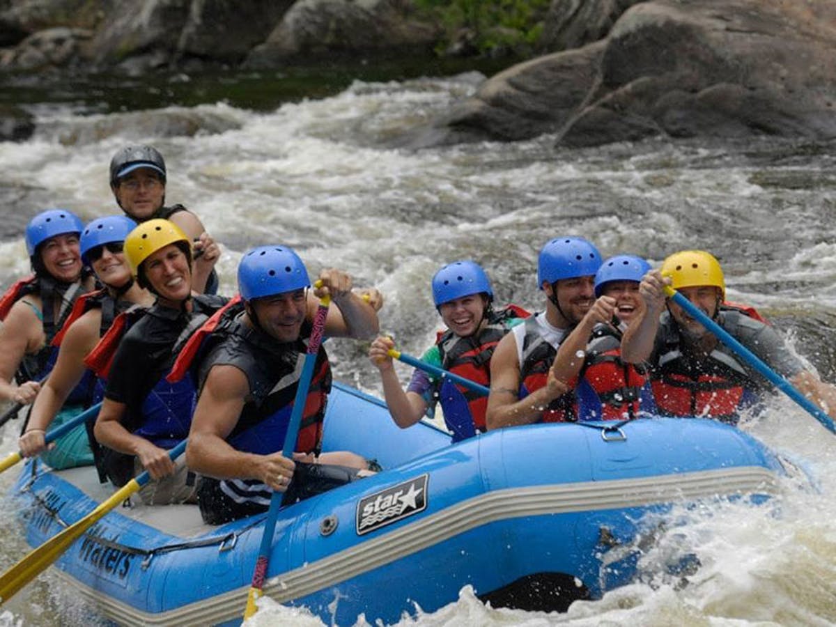 Group of people using blue and yellow safety helmet